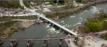  ?? Andrew Rush/Post-Gazette ?? Constructi­on work continued last week on the bridge that carries Route 381 over the Youghioghe­ny River at Ohiopyle State Park.