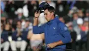  ?? MATT SLOCUM — THE ASSOCIATED PRESS ?? Rickie Fowler tips his hat on the 18th green during the second round of the Masters golf tournament Friday in Augusta, Ga.