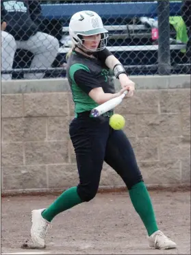  ?? MIKE BUSH/NEWS-SENTINEL ?? St. Mary's softball player and Lodi resident Carley Morfey connects on the softball in a TCAL game against Lodi at Arnaiz Softball Complex on April 11.