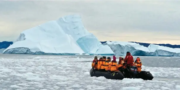  ??  ?? Above: Brash ice surrounds our Zodiak as we cruise between icebergs calved from Jakobshavn Glacier at Ilulissat. In this one location, up to 20 million tons of ice are released from the Greenland icecap every day— enough to keep New York city with...