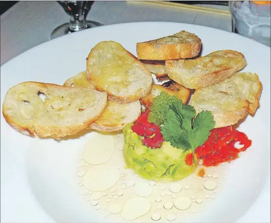  ?? KARL WELLS PHOTO ?? Basho’s tuna tartare with buttered toast.