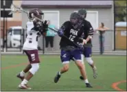  ?? AUSTIN HERTZOG - MEDIANEWS GROUP ?? Pottsgrove’s Khaliym Smith, left, takes a shot on goal as Phoenixvil­le’s Steven Schaefer defends Thursday.