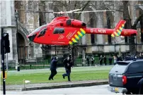  ??  ?? An air ambulance lands in Parliament Square during the incident on Westminste­r Bridge. —