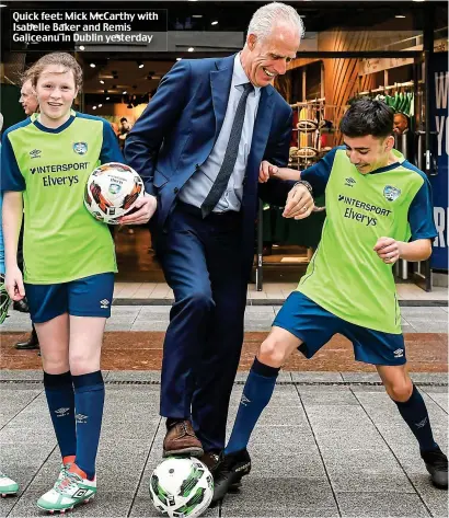  ??  ?? Quick feet: Mick McCarthy with Isabelle Baker and Remis Galiceanu in Dublin yesterday