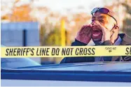  ?? MATTHEW HINTON/ASSOCIATED PRESS ?? A man cries out, “Where is my son?” after three people were killed at a gun store in Metairie, La., on Saturday afternoon. The shooter was one of the people fatally shot.