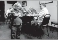  ?? Los Angeles Times/JOHN M. GLIONNA ?? Felix Silla once played one of the quirkiest roles on TV — shaggy Cousin Itt on The Addams Family. Here he stands with friends at a pizza joint west of The Strip in Las Vegas.