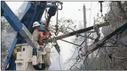  ?? STAFF FILE PHOTO ?? PG&amp;E crews remove power lines damaged by the Camp Fire off Bille Road in Paradise on Nov. 10.