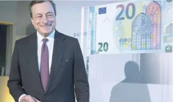  ?? — Reuters ?? Mario Draghi, ECB President, unveils the new €20 banknote, in this file photo.
