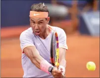  ?? AFP ?? Rafael Nadal hits a return during the match against Alex De Minaur. —