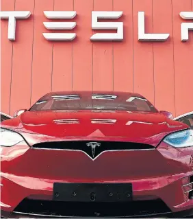  ?? JOHN THYSAFP VIA GETTY IMAGES FILE PHOTO ?? Electric vehicles are the fastest-growing sector of one the world’s biggest industries with global sales of expected to hit a record 6.3 million in 2021. Right now Tesla is king, with 2021 sales of 936,000 vehicles, up 91 per cent from the previous year. Last year, Ford sold 27,000 EVs. GM sold 25,000.