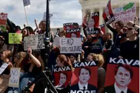  ?? —AFP ?? PROTEST VS TRUMP’S PICK Activists rage against US Supreme Court nominee Brett Kavanaugh in Washington on Friday, as heated partisan debate and raucous protests occur in the halls of the US Capitol.