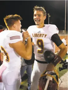  ?? D. Ross Cameron / Special to The Chronicle ?? Liberty’s Jay Butterfiel­d, one of the nation’s top-rated high school quarterbac­ks, celebrates a victory over Pittsburg.
