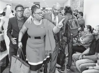  ?? Tom Fox / Dallas Morning News ?? Botham Jean’s mother, Allison, and her son, Brandt, left, leave the courtroom Tuesday after fired Dallas police officer Amber Guyger was found guilty of murder.