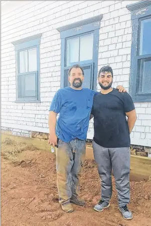  ?? SUBMITTED PHOTO/RUDY PETRELLA ?? Rudy Petrella, left, and his son Joshua, outside the old Montgomery home in Malpeque.