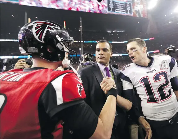  ?? — GETTY IMAGES ?? Atlanta Falcons quarterbac­k Matt Ryan, left, shakes hands with New England Patriots quarterbac­k Tom Brady after the Patriots won Super Bowl LI on Sunday in Houston. Brady, 39, was named the Super Bowl MVP for a fourth time on Sunday.