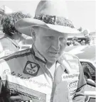  ?? HAL MOORE/AP FILE ?? Cale Yarborough walks away after blowing the engine of his Oldsmobile just after completing his first lap in pole position qualifying for the Daytona 500 in Daytona Beach, Fla., on Feb. 11, 1979.