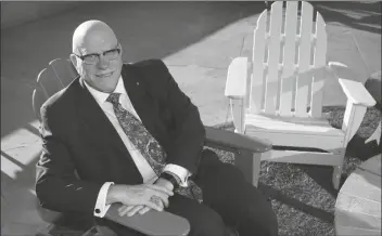  ?? ROSS D. FRANKLIN/AP ?? R. GLENN WILLIAMSON, CANADA’S ARIZONA HONORARY CONSUL and founder and CEO of the Canada Arizona Business Council, soaks up the morning sun at the Arizona Biltmore resort Wednesday, in Phoenix. Williamson says he’s looking forward to the return of Canadian snowbirds to the state now that vaccinated people from other countries can enter the U.S. by land starting Nov. 8.