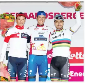  ??  ?? TOP THREE: From left, second placed Belgium's Oliver Naesen, overall winner Netherland­s' Niki Terpstra and third-placed Slovakia's Peter Sagan celebrate on the general ranking podium after the seventh and last stage of the Eneco Tour cycling race,...