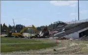  ?? BRIANA CONTRERAS — THE MORNING JOURNAL ?? The demolition of the 91-year-old grandstand at the original Ely Stadium in Elyria began July 11, with the press box to take the first tumble down.