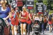  ?? Rich Pedroncell­i Associated Press ?? MARCHERS in Sacramento last year protest a vaccinatio­n exemption measure that ultimately passed.