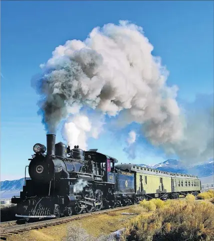  ?? Northern Nevada Railway ?? CAN YOU HEAR the whistle blowing? A steam locomotive chugs along, giving train buffs the ride of a lifetime near Ely, Nev.