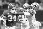  ?? JOHN BAZEMORE/ASSOCIATED PRESS ?? Alabama’s Damien Harris runs against Florida State defensive back Derwin James during the first half Saturday.