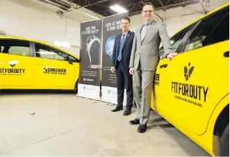  ?? GAVIN YOUNG ?? Jeff Bradshaw of Cannabis Learning Series, left, helps Checker cabs’ Kurt Enders train his staff.