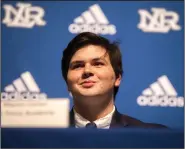 ??  ?? North Little Rock offensive lineman Mason Carlan awaits the start of his signing ceremony at the school Wednesday. Carlan signed a certificat­e of intent to play at the Air Force Academy. (Arkansas Democrat-Gazette/Stephen Swofford)