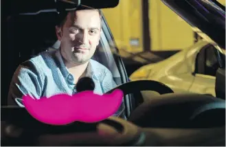  ?? NOAH BERGER, AP ?? Lyft co-founder John Zimmer displays his company’s “glowstache” following the City of Los Angeles’s decision to allow the ride-hailing service to operate at Los Angeles Internatio­nal Airport.