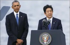  ?? AP PHOTO/MARCO GARCIA ?? Japanese Prime Minister Shinzo Abe (right), with U.S. President Barack Obama, speaks at Joint Base Pearl Harbor Hickam, on Tuesday in Honolulu.