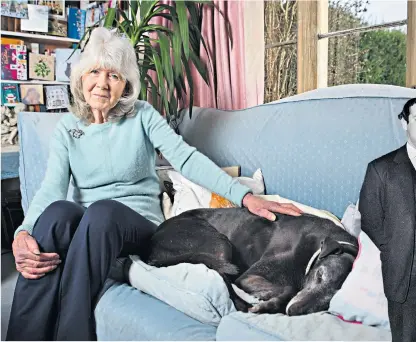  ??  ?? Older and wiser: Jilly Cooper relaxing at home in Gloucester­shire with her dog Bluebell and, below, with late husband Leo on their wedding day in 1961