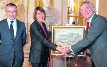  ?? Getty Images ?? French Culture minister Christine Albanel (center) shakes hands with Stuart Glyn, chairman of the British branch of Red Star of David, Israel’s emergency medical service, after returning to him a painting by Henri Matisse stolen by Nazis during World War II from its Jewish owner. The 1898 painting is named “Le Mur rose, de l'hopital d'Ajaccio” (“The pink wall, from Ajaccio's hospital”). At left is Alain Seban, head of the Pompidou art center in Paris, where the painting had been stored.