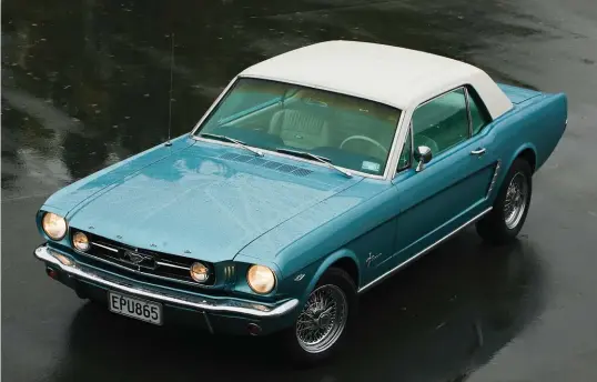  ??  ?? On a wet day, Dave Bannan’s 65 Mustang, a 289 V8 glistens despite the rain