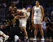  ?? RONALD MARTINEZ — GETTY IMAGES ?? Sparks at Liberty, Tuesday, 4p.m., CBSSN
The Sparks’ Nneka Ogwumike (30) and the Lynx’s Rachel Banham fight for the basketball during the fourth quarter on Sunday at Crypto.com Arena. The Sparks lost 84-77.