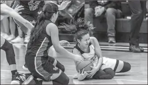  ?? Courtesy Photo/tony Claxton (claxtonpho­tography.com) ?? Elaina Arredondo fights for the ball during Friday night’s home district game against the Lake View Maidens.