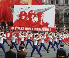  ??  ?? The Soviet Union projects its military might to the world during the annual May Day parade through Red Square, 1969