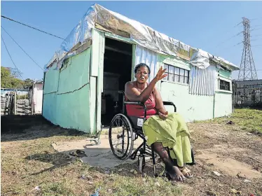  ?? Pictures: WERNER HILLS ?? DAILY STRUGGLE: Thunyelwa Lukho, 43 , who uses a wheelchair, talks about her struggles since the devastatin­g fire in Area Q