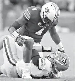  ?? Curtis Compton/Atlanta Journal-Constituti­on via AP ?? Auburn linebacker Jeff Holand tackles Georgia quarterbac­k Jake Fromm during the first half Nov. 11 in Auburn, Ala. Three weeks after an ugly loss at Auburn, No. 6 Georgia has perhaps the biggest do-over in school history. At stake will be the...