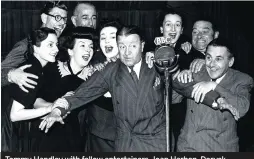  ??  ?? Tommy Handley with fellow entertaine­rs Joan Harben, Deryck Guyler, Linda Joyce , Hattie Jacques, Fred Yule and Jack Train