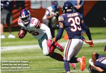  ?? CHARLES REX ARBOGAST/AP ?? Giants running back Saquon Barkley was hurt on a tackle by Bears safety Eddie Jackson.