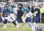  ?? Michael Perez / Associated Press ?? Philadelph­ia’s Boston Scott jumps over Dallas’ C.J. Goodwin during the Eagles’ 17-9 win over the Cowboys on Sunday. The win puts the Eagles in the NFC East driver’s seat and they can clinch a playoff spot with a win against the Giants on Sunday.