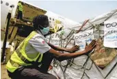  ?? DIOMANDE BLE BLONDE AP FILE ?? A shipment of COVID-19 vaccines distribute­d by the COVAX Facility arrives in Abidjan, Ivory Coast.