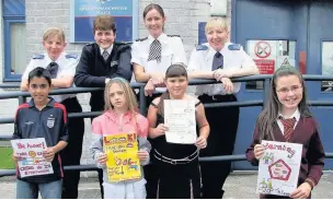  ??  ?? Winners of the Royton police poster competitio­n with their entries