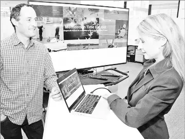  ??  ?? Aude Oliva (right) and Dan Gutfreund are the principal investigat­ors for the Moments in Time Dataset. — Photo by John Mottern/Feature Photo Service for IBM