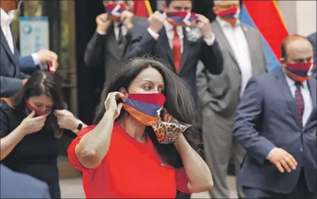  ?? LOS ANGELES Al Seib Los Angeles Times ?? Council President Nury Martinez dons a mask with the f lag of the Republic of Artsakh, an entity recognized by Armenia.