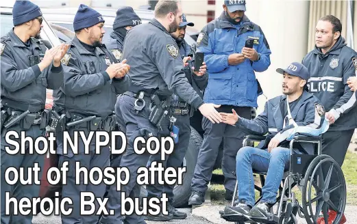  ?? ?? HONOR ROLL: Officer Paul Lee gets a “walkout” salute outside St. Barnabas on Tuesday after surviving gunshots to his police vehicle (below).