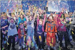  ?? [AP PHOTO] ?? In this photo provided by NASA, New Horizons principal investigat­or Alan Stern, of the Southwest Research Institute in Boulder, Colo., center, celebrates with school children at the exact moment that the New Horizons spacecraft made the closest approach of Kuiper Belt object Ultima Thule, early Tuesday at Johns Hopkins University Applied Physics Laboratory in Laurel, Md.