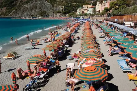  ?? Susan Wright / The New York Times file ?? An umbrella-lined beach in Monterosso, one of the five towns of the Cinque Terre, Italy.