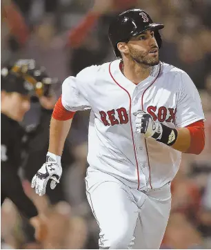  ?? STAFF PHOTO BY CHRISTOPHE­R EVANS ?? TOUCH ’EM ALL: J.D. Martinez watches his 11th homer of the season during the Red Sox’ 6-5 loss to the Oakland A’s last night at Fenway Park.