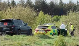  ??  ?? Rescue: Emergency services staff near Edenderry yesterday